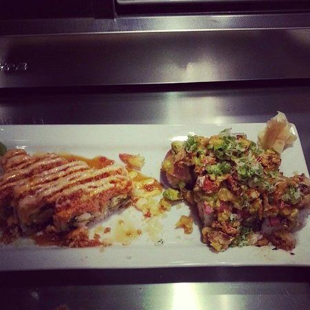 Tsunami Sushi Bar. Wok & Grill